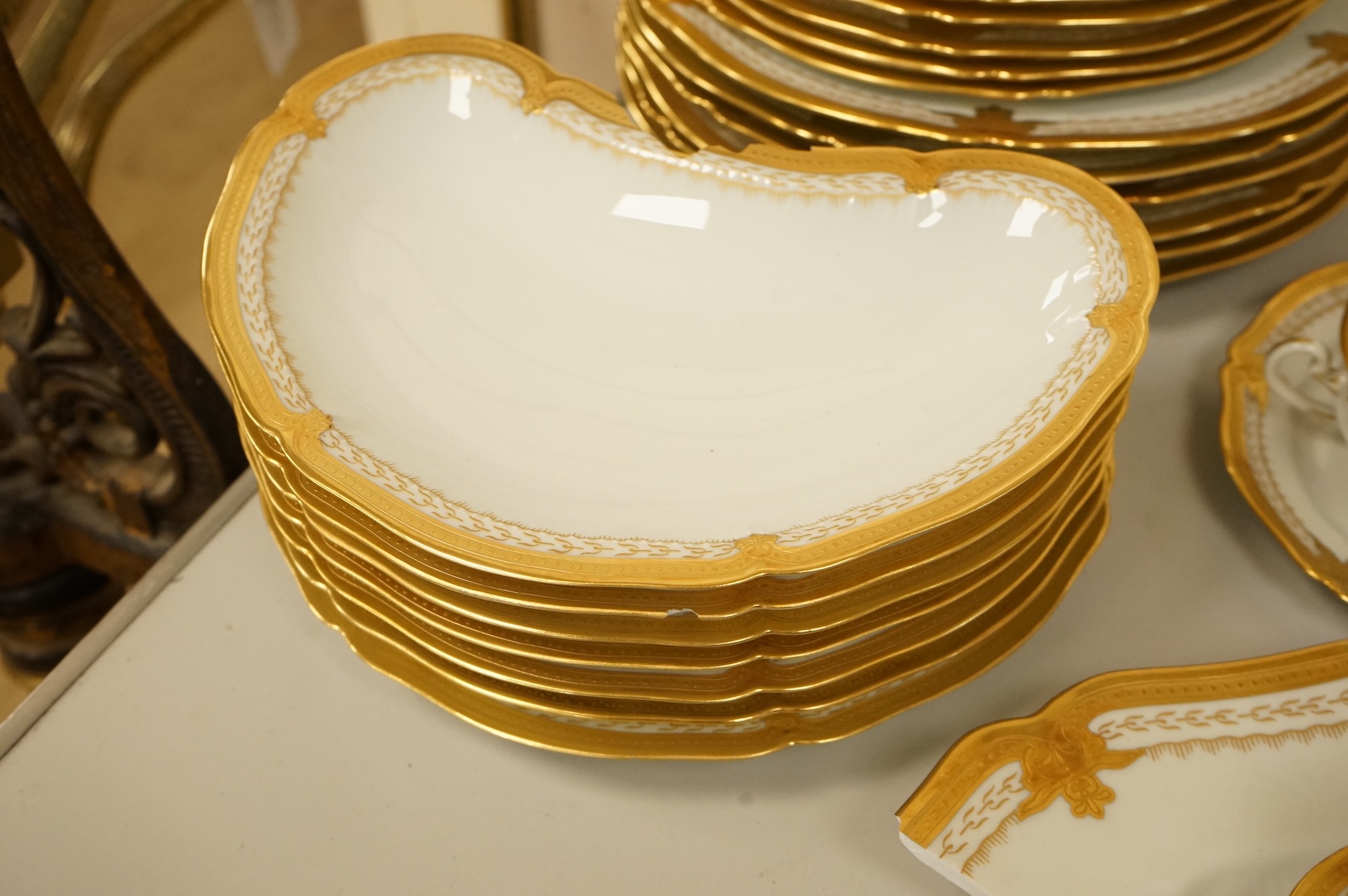 A Haviland Limoges dinner service with gilt border
